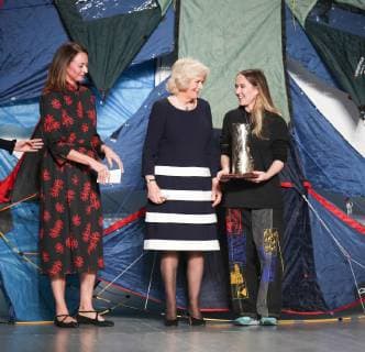 February 19, 2019 - London, United Kingdom - HRH Duchess of Cornwall Camilla presents Elizabeth II Award for young talents in fashion to the winner Bethany Williams (from left Caroline Rush, HRH Duchess of Cornwall, Bethany Williams) during London Fashion Week February 2019 at the BFC show space on February 19, 2019 in London, England. London United Kingdom  - ZUMAn230 20190219_zaa_n230_836 Copyright: xDominikaxZarzyckax