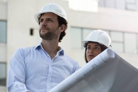 Architects reviewing blueprint  Copyright: EricxAudras B08336537