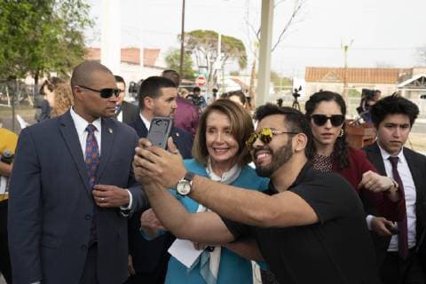 February 22, 2019 - Laredo, TX, USA - Laredo, Texas Feb. 22, 2019: Carlos Gaytan takes a selfie as House Speaker Nancy Pelosi talks to the press at Port of Entry 2 after touring the Texas-Mexico border Friday. Pelosi and Congressman Henry Cuellar, D-Laredo, both agree that there is no border crisis that requires Trump s emergency declaration. Laredo USA - ZUMAd150 20190222_znp_d150_038 Copyright: xBobxDaemmrichx