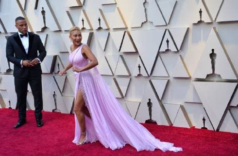 DeVon Franklin (L) and Meagan Good arrive on the red carpet for the 91st annual Academy Awards at the Dolby Theatre in the Hollywood section of Los Angeles on February 24, 2019.  LAP20190224045 JIMxRUYMEN