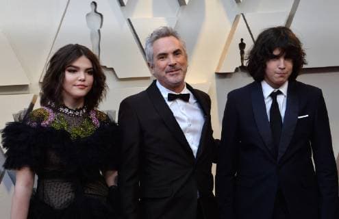 Alfonso Cuaron (C) and guests arrive on the red carpet for the 91st annual Academy Awards at the Dolby Theatre in the Hollywood section of Los Angeles on February 24, 2019.  LAP20190224158 JIMxRUYMEN