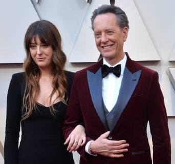 Richard E. Grant (R) and Olivia Grant arrive on the red carpet for the 91st annual Academy Awards at the Dolby Theatre in the Hollywood section of Los Angeles on February 24, 2019.  LAP20190224240 JIMxRUYMEN