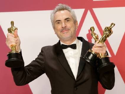 Alfonso Cuaron, winner of Best Foreign Language Film, Best Director and Best Cinematography for Roma, appears backstage with his Oscars during the 91st annual Academy Awards at Loews Hollywood Hotel in the Hollywood section of Los Angeles on February 24, 2019.  LAP20190224755 JOHNxANGELILLO