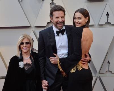 (L-R) Gloria Campano, Bradley Cooper, and Irina Shayk arrive on the red carpet for the 91st annual Academy Awards at the Dolby Theatre in the Hollywood section of Los Angeles on February 24, 2019.  LAP201902240249 JIMxRUYMEN