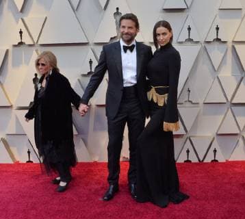 (L-R) Gloria Campano, Bradley Cooper, and Irina Shayk arrive on the red carpet for the 91st annual Academy Awards at the Dolby Theatre in the Hollywood section of Los Angeles on February 24, 2019.  LAP201902240250 JIMxRUYMEN
