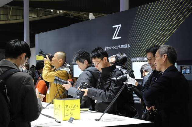 February 28, 2019, Yokohama, Japan - Visitors try to use latest camera products of Japanese camera maker Nikon at the CP+ camera and photo exhibition in Yokohama, suburban Tokyo on Thursday, February 28, 2019. Some 70,000 camera fans are expecting to visit a four-day exhibition.  (98165981)