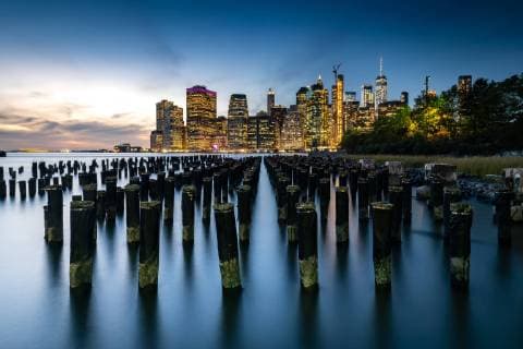 Long exposure of the lights of Lower Manhattan during the evening blue hour as seen from Brooklyn Bridge Park, New York, United States of America, North America Copyright: MattxParry 1263-137