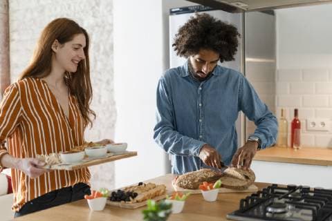 Couple standing in kitchen, preparing dinner party model released Symbolfoto property released  ERRF00531