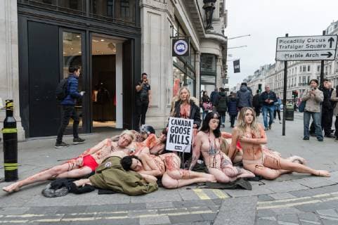 March 1, 2019 - London, Greater London, United Kingdom - Activists from People for the Ethical Treatment of Animals (PETA) lie nearly naked and covered with fake blood outside Canada Goose flagship store in London on 01 March, 2019, as they protest against use of coyote fur by the retailer and the cruel practices associated with its sourcing. London United Kingdom  - ZUMAn230 20190301_zaa_n230_353 Copyright: xWiktorxSzymanowiczx