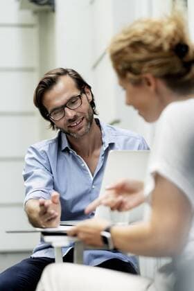 Happy couple working from home, sitting in their garden model released Symbolfoto property released  HHLMF00601