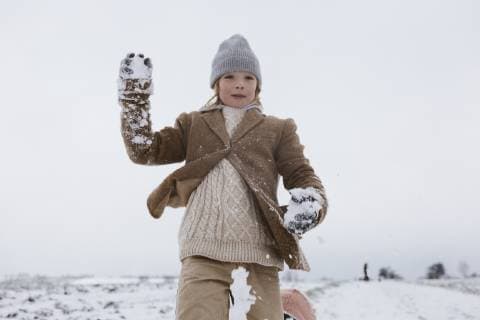 Happy boy playing with snow model released Symbolfoto  KMKF00127