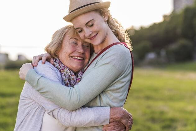 Happy grandmother and granddaughter hugging each other model released Symbolfoto  UUF11382