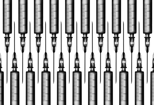 Multiple syringes organized in a pattern over white background  DRBF00120