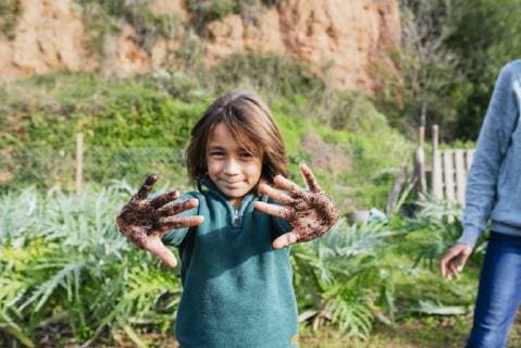 Boy showing his messy hands, full of soil model released Symbolfoto property released  GEMF02761