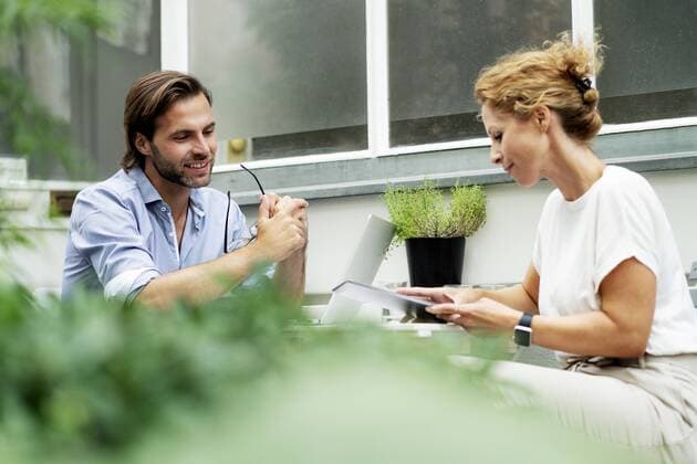 Happy couple working from home, sitting in their garden model released Symbolfoto property released  HHLMF00565