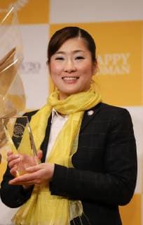 March 8, 2019, Tokyo, Japan - Japanese beauty treatment salon operator Vieris president Maiko saeki holds the trophy as she receives the Happy Woman Award 2019 for SDGs on the International Women s Day in Tokyo on Friday, March 8, 2019. Five women were awarded as they contributed to the promotion of gender equality and UN s SDGs.  (98742904)