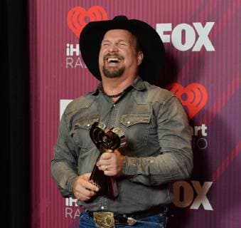 Garth Brooks, winner of the award for Artist of the Decade appears backstage during the sixth annual iHeartRadio Music Awards at the Microsoft Theater in Los Angeles, California on March 14, 2019. The annual award show will broadcast live on FOX.  LAP20190314806 JIMxRUYMEN