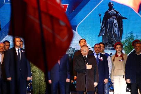 SEVASTOPOL, RUSSIA - MARCH 18, 2018: Head of Crimea Sergei Aksyonov (L front) and Russia s President Vladimir Putin (C front) attend a concert marking the 5th anniversary of the Crimean status referendum and its reunification with Russia in Sevastopol. Sergei Malgavko TASS  TS0A5009