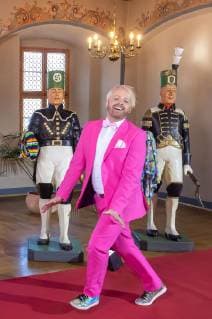 Shooting for the MDR show Musik für Sie in the Rathaus in Annaberg Buchholz on 20 03 2019 singer and entertainer Ross Antony runs in front of two carved miner figures Annaberg Buchholz Sachsen Germany
