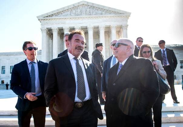 Former Gov. Arnold Schwarzenegger, R-Calif., (L), talks to Gov. Larry Hogan, R-MD, at a press conference on ending gerrymandering and fair election maps, outside of the Supreme Court in Washington, D.C. on March 26, 2019. The high court is hearing arguments on two gerrymandering cases today.  WAP20190326342 KEVINxDIETSCH