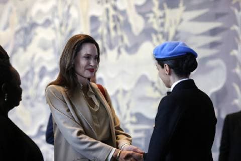 (190330) -- UNITED NATIONS, March 30, 2019 -- Angelina Jolie (L), a special envoy for the United Nations Refugee Agency (UNHCR), shakes hands with Lieutenant Commander Marcia Andrade Graga, UN Military Gender Advocate of the Yeart, at the UN headquarters in New York March 29, 2019. There is still much more to do to increase the number of women in the ranks of the UN peacekeeping missions, said Hollywood actress Angelina Jolie on Friday at the UN Headquarters in New York. ) UN-PEACEKEEPING-ANGELINA JOLIE LIxMUZI 