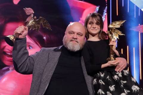 MOSCOW, RUSSIA â€“ MARCH 30, 2019: Director Alexei Fedorchenko (L) with an award for Best Motion Picture for his film Anna s War and actress Marta Kozlova with an award for Best Actress for her role in Anna s War at the 32nd Nika Film Award Ceremony. Vyacheslav Prokofyev TASS  TS0A673D