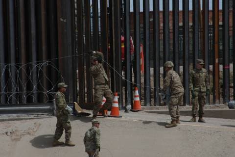 Mexico: Army of USA arrived at the border between Juarez and El Paso Soldiers from the United States, arrived at the border between Juarez and El Paso, Texas, United States, to take care of the frontier border, of the migrants, installed barbed wire near the wall that divides both countries Juarez Chihuahua Mexico  DavidxPeinado