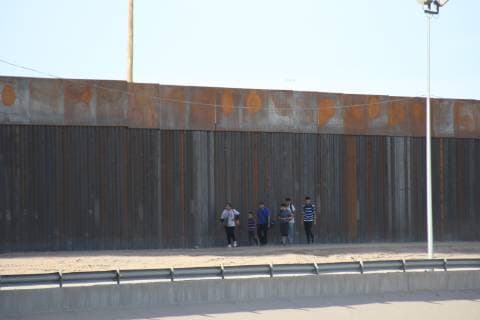 Mexico: Migrants cross the border Three women and a baby of Honduras crossed the border limit between Mexico and the United States to give up to the authorities, to be able to ask for political asylum. jUarez Chihuahua Mexico  DavidxPeinado