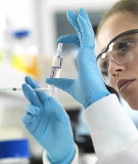Pharmaceutical Research, Scientist preparing a new drug for testing in the laboratory model released Symbolfoto property released  ABRF00316
