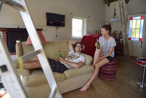 Happy young couple having a break from renovating their home model released Symbolfoto property released  ECPF00200