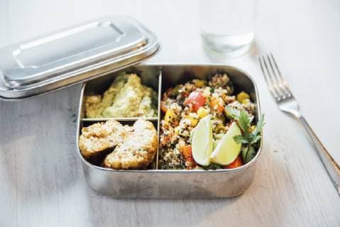 Bento box of quinoa salad with vegetables and lime, avocado cream and cauliflower dumplings  IPF00496