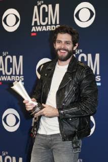April 7, 2019 - Las Vegas, Nevada, United States - Thomas Rhett holds the trophy for winning ACM Male Vocalist of the Year at the 54th Academy of Country Music Awards at MGM Grand Arena in Las Vegas, Nevada. Las Vegas United States - ZUMAw109 20190407_zap_w109_078 Copyright: xDebbyxWongx