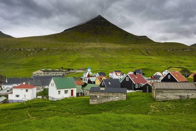 Denmark, Faroe islands, Estuyroy, Colourful houses in the village of Gjogv  RUNF00541