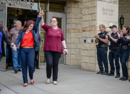 April 12, 2019 - Albuquerque, New Mexico, U.S. - .Michelle Carlino-Webster(Cq),left, raises her arm signaling victory after Accused cop killer Davon Lymon(Cq) was found guilty in Judge Neil Candelaria s courtroom Friday afternoon. Lymon was accused of killing her husband APD officer Daniel Webster..Albuquerque, New Mexico Journal Albuquerque U.S. - ZUMAab1_ 20190412_zaf_ab1_015 Copyright: xRobertoxE.xRosalesx
