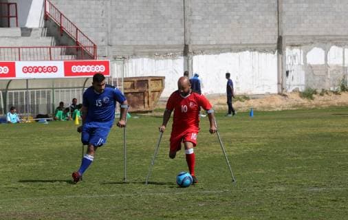 April 13, 2019 - Gaza City, Gaza Strip, Palestinian Territory - Palestinian amputees using crutches play a football match during the first football tournament for amputees, at Palestine Stadium in Gaza city, on April 13, 2019. More than 125 have had amputations shot by Israeli forces during a year of weekly mass protests along the Gaza border, according to Palestinian figures Gaza City Palestinian Territory - ZUMAap3_ 20190413_zaf_ap3_082 Copyright: xAshrafxAmrax
