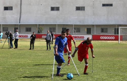 April 13, 2019 - Gaza City, Gaza Strip, Palestinian Territory - Palestinian amputees using crutches play a football match during the first football tournament for amputees, at Palestine Stadium in Gaza city, on April 13, 2019. More than 125 have had amputations shot by Israeli forces during a year of weekly mass protests along the Gaza border, according to Palestinian figures Gaza City Palestinian Territory - ZUMAap3_ 20190413_zaf_ap3_080 Copyright: xAshrafxAmrax