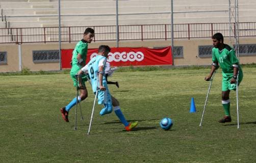 April 13, 2019 - Gaza City, Gaza Strip, Palestinian Territory - Palestinian amputees using crutches play a football match during the first football tournament for amputees, at Palestine Stadium in Gaza city, on April 13, 2019. More than 125 have had amputations shot by Israeli forces during a year of weekly mass protests along the Gaza border, according to Palestinian figures Gaza City Palestinian Territory - ZUMAap3_ 20190413_zaf_ap3_058 Copyright: xAshrafxAmrax
