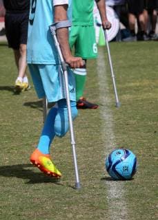 April 13, 2019 - Gaza City, Gaza Strip, Palestinian Territory - Palestinian amputees using crutches play a football match during the first football tournament for amputees, at Palestine Stadium in Gaza city, on April 13, 2019. More than 125 have had amputations shot by Israeli forces during a year of weekly mass protests along the Gaza border, according to Palestinian figures Gaza City Palestinian Territory - ZUMAap3_ 20190413_zaf_ap3_047 Copyright: xAshrafxAmrax