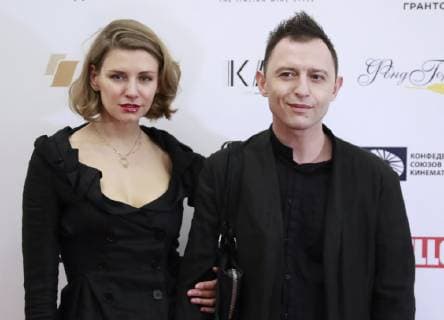 MOSCOW, RUSSIA - APRIL 14, 2019: Actor musician Roman Bilyk (Roma Zver) with wife Marina arrive for the 2nd East â€“ West: Golden Arch award ceremony at Et Cetera Theatre; East â€“ West. Golden Arch is an international prize awarded to films made in Eastern Europe and Western Asia. Sergei Fadeichev TASS  TS0A8302