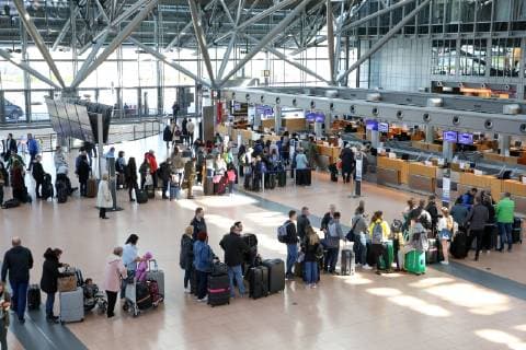 Hamburg Airport 16 04 2019 DEU Germany Hamburg Travelers waiting in queues at check-in counters at Hamburg Airport Hamburg Hamburg Germany