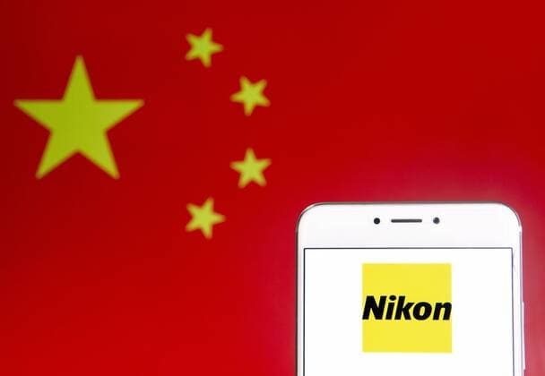 April 6, 2019 - Hong Kong - In this photo illustration a Japanese multinational electronics corporation and manufacturer Nikon logo is seen on an Android mobile device with People s Republic of China flag in the background. Hong Kong - ZUMAs197 20190406_zab_s197_349 Copyright: xBudrulxChukrutx