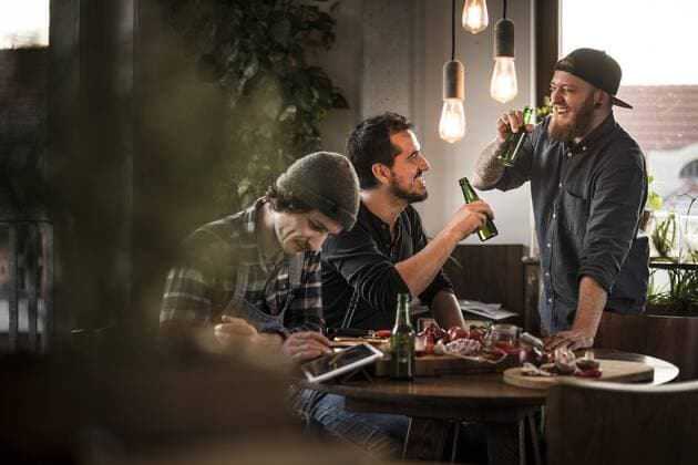 Friends drinking beer and eating together, what they have cooked model released Symbolfoto property released  MJRF00065
