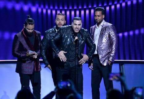 (L-R) Lenny Santos, Henry Santos, Max Santos and Romeo Santos, of Aventura, accept the Tropical Artist of the Year, Duo or Group award during the 26th annual Billboard Latin Music Awards at the Mandalay Bay Events Center in Las Vegas, Nevada on April 25, 2019.  LAV20190425478 JIMxRUYMEN