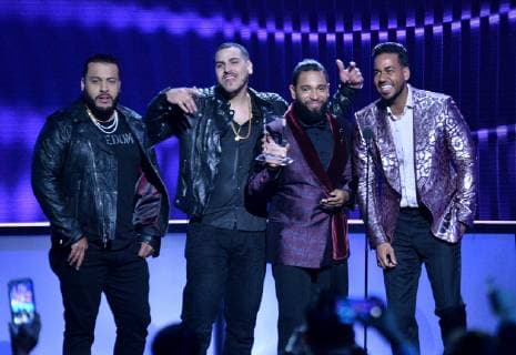 (L-R) Lenny Santos, Max Santos, Henry Santos and Romeo Santos, of Aventura, accept the Tropical Artist of the Year, Duo or Group award during the 26th annual Billboard Latin Music Awards at the Mandalay Bay Events Center in Las Vegas, Nevada on April 25, 2019.  LAV20190425476 JIMxRUYMEN