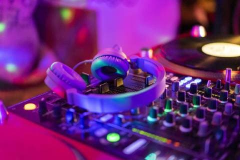 Headphones on illuminated mixing board  AFVF02349
