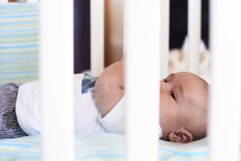 Little boy in the cradle at home model released Symbolfoto property released  IGGF00854