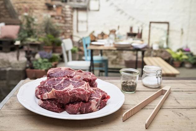 Barbecue in a backyard, steaks on a plate property released  PDF01796