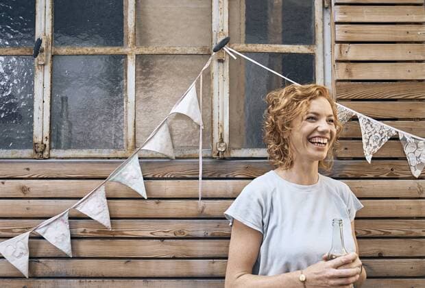 Young woman having fun at a barbecue party, drinking beer model released Symbolfoto property released  PDF01833
