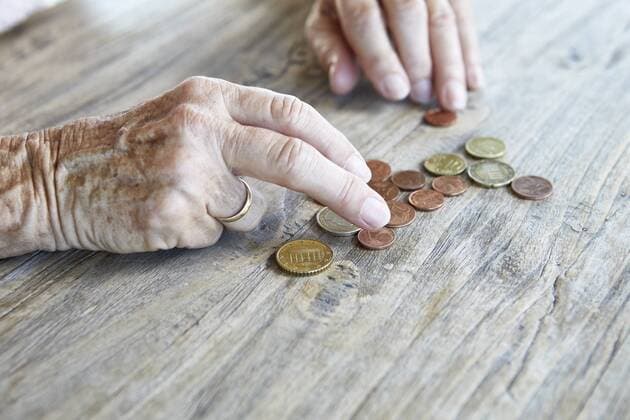 Hand of senior woman counting coins, close-up model released Symbolfoto property released  RBF06990