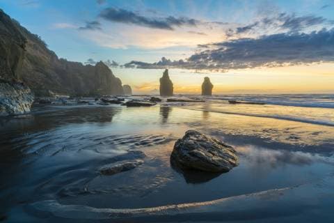 Reflection of the Three Sisters with low tide, at sunset, Tongaporutu, New Plymouth district, Taranaki region, North Island, New Zealand, Pacific Copyright: francescoxvaninetti 1251-470